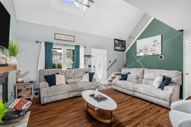 304 Hank Aaron Cv, La Vergne, TN 37086 - living area featuring wood finished floors, stairs, a skylight, and high vaulted ceiling