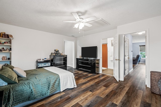 304 Hank Aaron Cv, La Vergne, TN 37086 - bedroom with attic access, wood finished floors, a textured ceiling, and a ceiling fan
