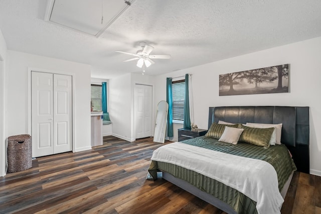 304 Hank Aaron Cv, La Vergne, TN 37086 - bedroom with attic access, wood finished floors, multiple closets, a textured ceiling, and ceiling fan