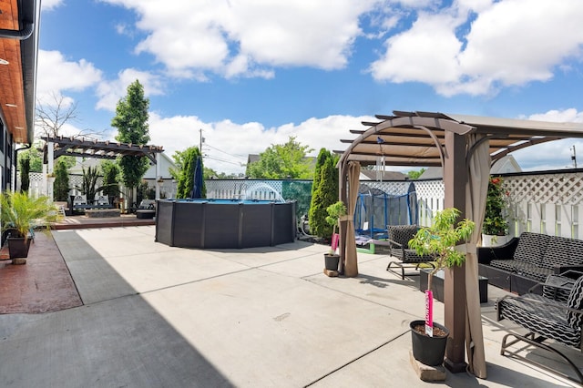 304 Hank Aaron Cv, La Vergne, TN 37086 - fenced backyard with a pergola, an outdoor hangout area, and a patio area
