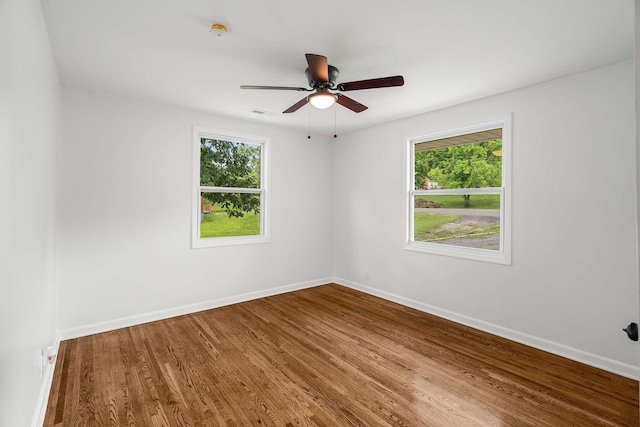 2607 Mashburn Ct, Nashville, TN 37210 - empty room with healthy amount of natural light, baseboards, and wood finished floors