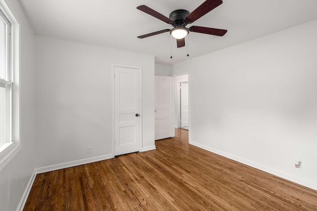 2607 Mashburn Ct, Nashville, TN 37210 - unfurnished bedroom featuring baseboards, wood finished floors, and a ceiling fan