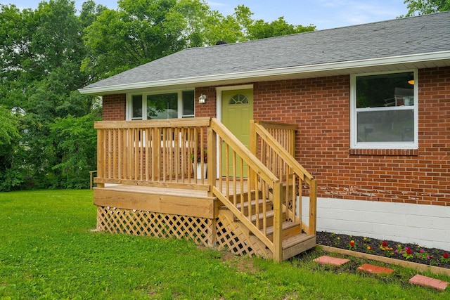 2607 Mashburn Ct, Nashville, TN 37210 - view of exterior entry with a shingled roof, brick siding, a lawn, and a wooden deck