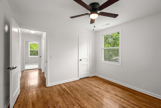 2607 Mashburn Ct, Nashville, TN 37210 - unfurnished bedroom with baseboards, wood finished floors, attic access, and ceiling fan