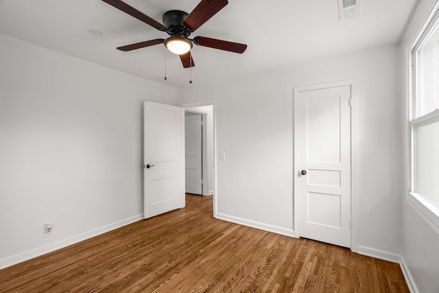 2607 Mashburn Ct, Nashville, TN 37210 - unfurnished bedroom featuring wood finished floors, baseboards, and a ceiling fan