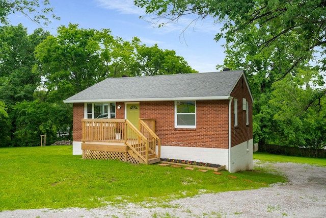 2607 Mashburn Ct, Nashville, TN 37210 - view of front facade with brick siding, a front yard, and roof with shingles