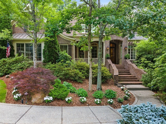 6521 Stableford Ln, Franklin, TN 37069 - view of front of house with a standing seam roof and brick siding