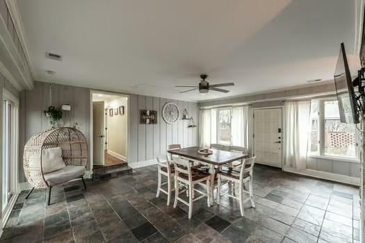 126 Harsh Ln, Castalian Springs, TN 37031 - dining room featuring ceiling fan and dark stone finish flooring