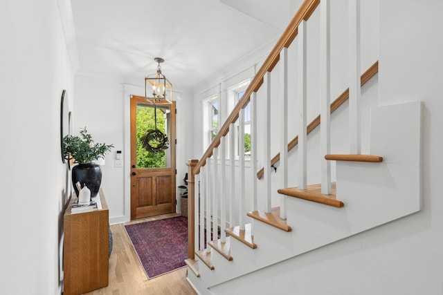 423A American Rd, Nashville, TN 37209 - foyer entrance featuring stairs, wood finished floors, a chandelier, and crown molding