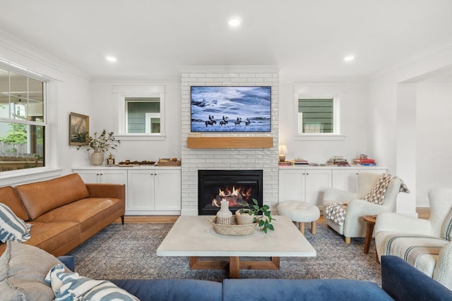 423A American Rd, Nashville, TN 37209 - living room with a fireplace, crown molding, wood finished floors, and recessed lighting