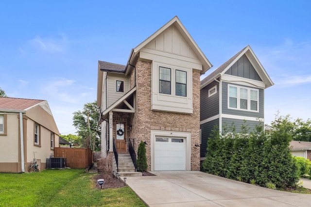 423A American Rd, Nashville, TN 37209 - view of front of property with board and batten siding, concrete driveway, brick siding, an attached garage, and cooling unit