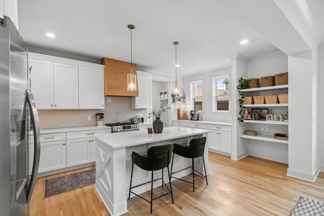423A American Rd, Nashville, TN 37209 - kitchen featuring stainless steel appliances, light countertops, white cabinetry, ornamental molding, and recessed lighting