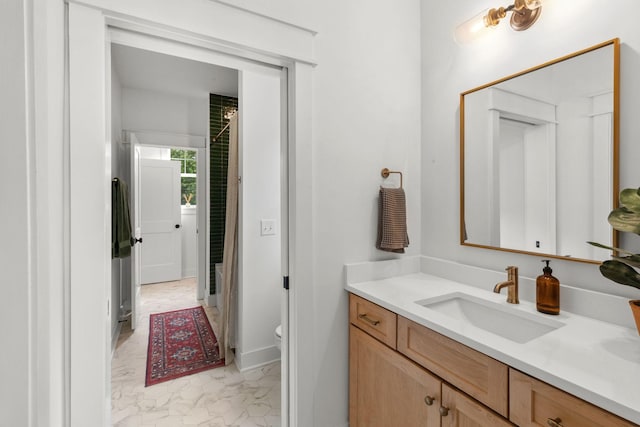423A American Rd, Nashville, TN 37209 - full bath with marble look tile flooring, vanity, toilet, and a shower with curtain