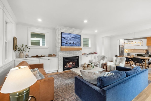 423A American Rd, Nashville, TN 37209 - living room with light wood-style flooring, a fireplace, and recessed lighting