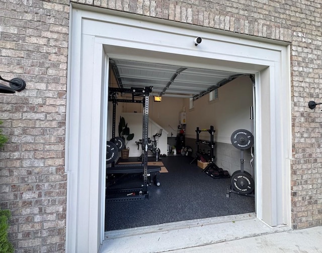 423A American Rd, Nashville, TN 37209 - exercise room featuring brick wall and a garage