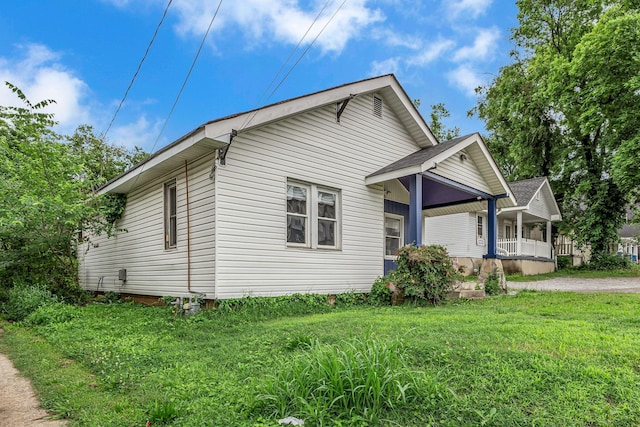 1049 E Trinity Ln, Nashville, TN 37216 - view of home's exterior featuring a porch and a lawn