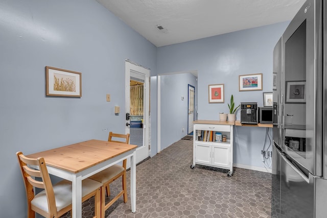 1049 E Trinity Ln, Nashville, TN 37216 - kitchen with smart refrigerator and white cabinets