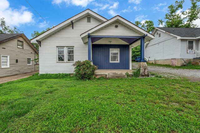 1049 E Trinity Ln, Nashville, TN 37216 - view of front of property with a porch, a front lawn, and dirt driveway