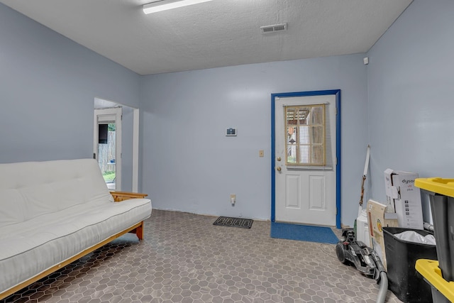 1049 E Trinity Ln, Nashville, TN 37216 - sitting room with plenty of natural light, carpet, and a textured ceiling