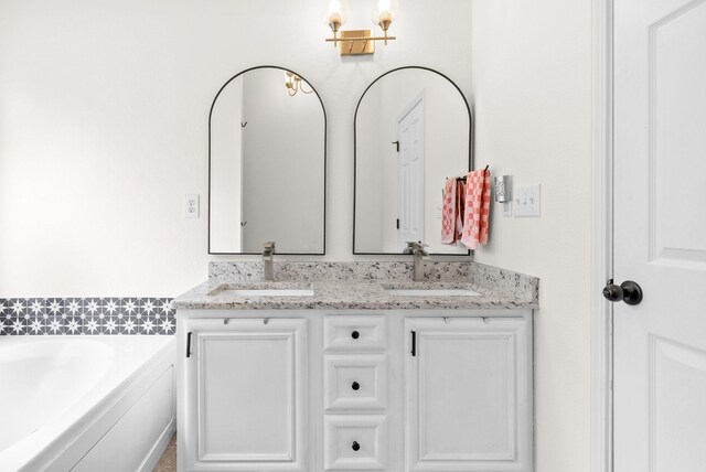 1052 Freedom Dr, Clarksville, TN 37042 - bathroom featuring double vanity and a bath