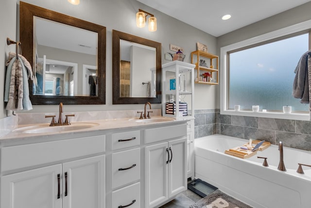 3555 Neena Ct, Clarksville, TN 37042 - full bathroom featuring double vanity and a garden tub