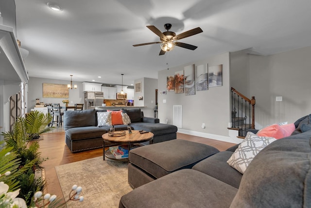 3555 Neena Ct, Clarksville, TN 37042 - living area with wood finished floors, a ceiling fan, stairs, baseboards, and recessed lighting