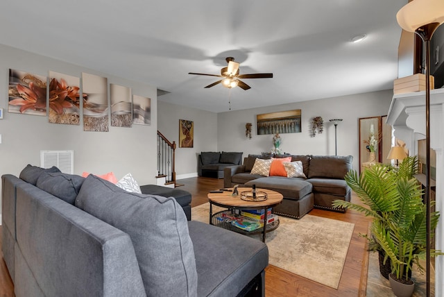 3555 Neena Ct, Clarksville, TN 37042 - living room featuring stairway, a ceiling fan, wood finished floors, and baseboards