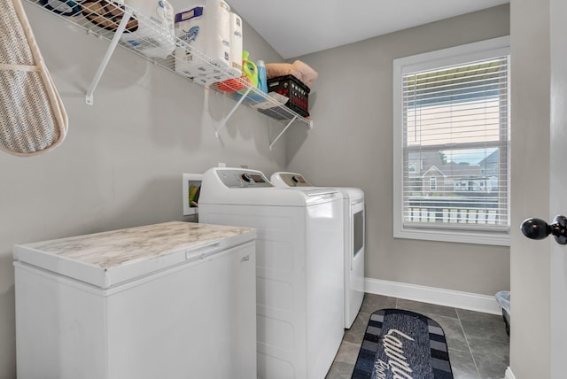 3555 Neena Ct, Clarksville, TN 37042 - laundry area featuring washing machine and clothes dryer, healthy amount of natural light, and baseboards