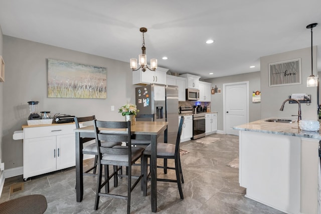 3555 Neena Ct, Clarksville, TN 37042 - dining space with recessed lighting, baseboards, and a chandelier