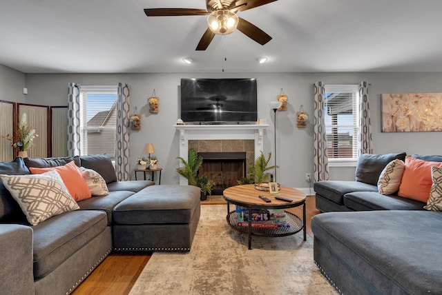 3555 Neena Ct, Clarksville, TN 37042 - living area with a ceiling fan, a tiled fireplace, wood finished floors, and recessed lighting