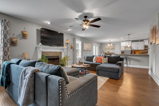 3555 Neena Ct, Clarksville, TN 37042 - living room with a fireplace, ceiling fan, wood finished floors, recessed lighting, and baseboards