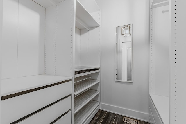 8560 Coopertown Rd, Joelton, TN 37080 - walk in closet with dark wood-style flooring