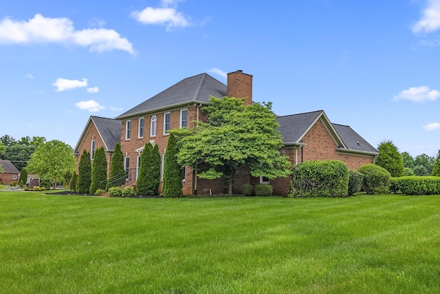 8560 Coopertown Rd, Joelton, TN 37080 - view of front facade featuring brick siding, a front lawn, and a chimney