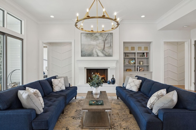 8118 Heirloom Blvd, College Grove, TN 37046 - living area featuring a chandelier, crown molding, a warm lit fireplace, wood finished floors, and recessed lighting