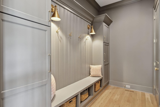 8118 Heirloom Blvd, College Grove, TN 37046 - mudroom with light wood-type flooring, crown molding, and baseboards