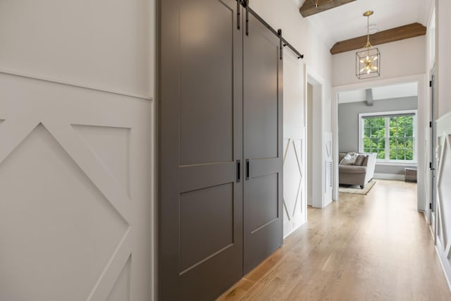 8118 Heirloom Blvd, College Grove, TN 37046 - hallway featuring a barn door, beamed ceiling, light wood-type flooring, and a chandelier