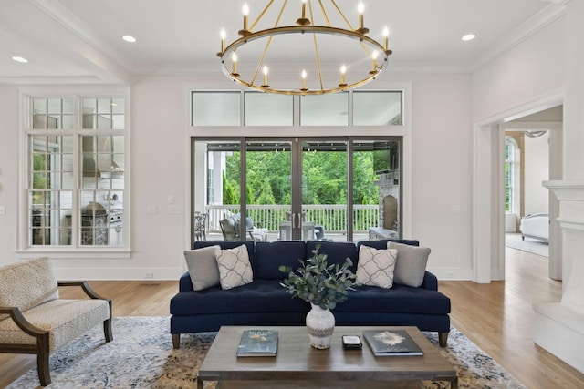 8118 Heirloom Blvd, College Grove, TN 37046 - living area with healthy amount of natural light, a chandelier, wood finished floors, ornamental molding, and baseboards