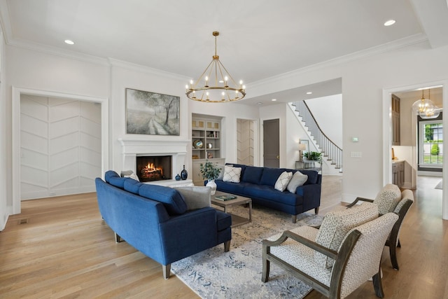 8118 Heirloom Blvd, College Grove, TN 37046 - living area featuring a chandelier, light wood-type flooring, stairway, ornamental molding, and recessed lighting