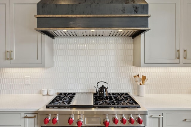 8118 Heirloom Blvd, College Grove, TN 37046 - kitchen with range hood, high end range, decorative backsplash, and light countertops