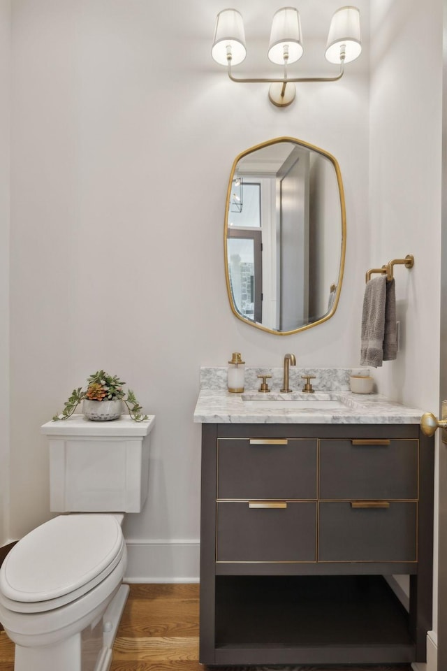 8118 Heirloom Blvd, College Grove, TN 37046 - bathroom with toilet, vanity, wood finished floors, and baseboards