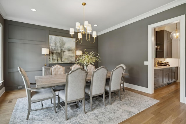 8118 Heirloom Blvd, College Grove, TN 37046 - dining space featuring a chandelier, ornamental molding, wood finished floors, recessed lighting, and baseboards