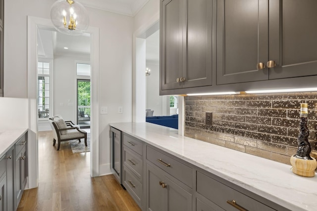 8118 Heirloom Blvd, College Grove, TN 37046 - kitchen featuring gray cabinets, light wood-type flooring, backsplash, and beverage cooler