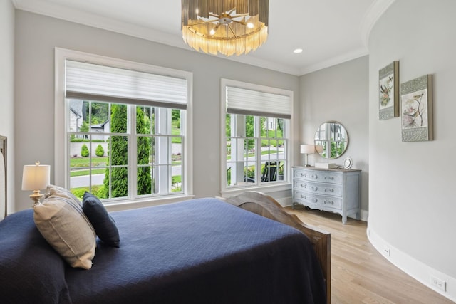 8118 Heirloom Blvd, College Grove, TN 37046 - bedroom with ornamental molding, baseboards, light wood finished floors, and a chandelier