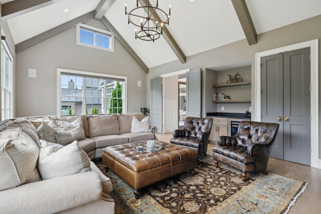 8118 Heirloom Blvd, College Grove, TN 37046 - living room featuring beam ceiling, a chandelier, light wood finished floors, high vaulted ceiling, and bar area