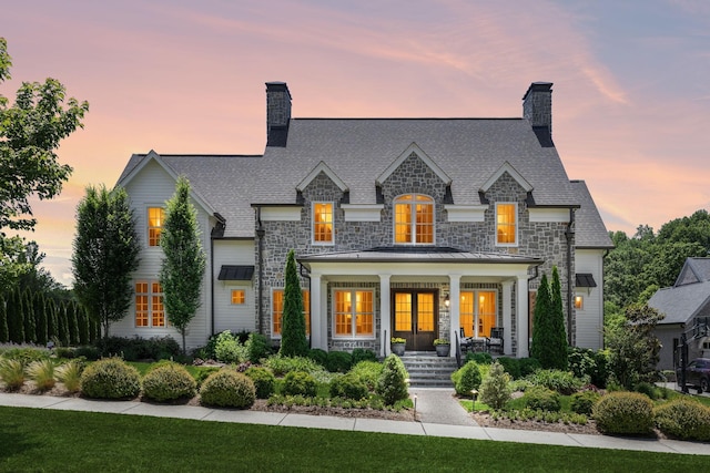 8118 Heirloom Blvd, College Grove, TN 37046 - french provincial home with a chimney, a porch, and stone siding