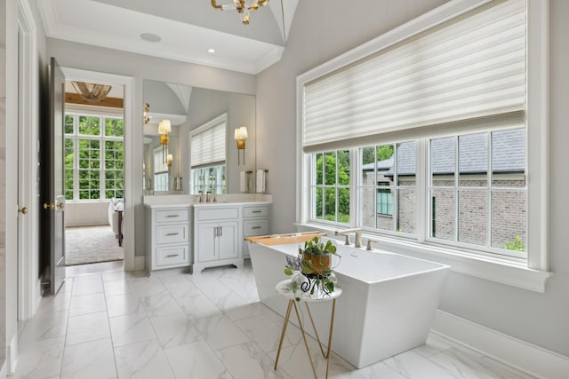 8118 Heirloom Blvd, College Grove, TN 37046 - bathroom featuring vanity, a chandelier, a soaking tub, marble finish floors, and baseboards