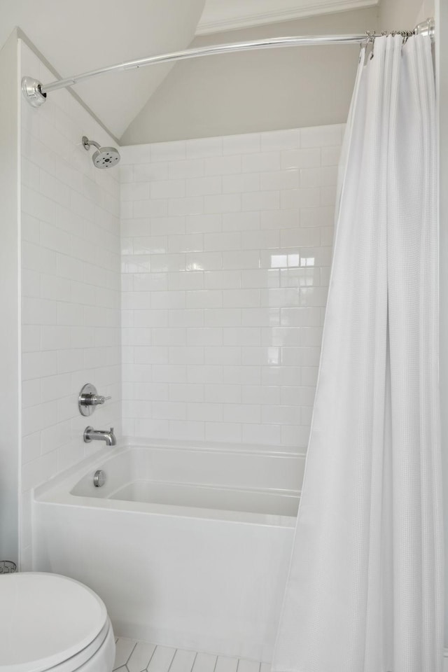 8118 Heirloom Blvd, College Grove, TN 37046 - bathroom featuring toilet, shower / bath combo with shower curtain, tile patterned floors, and lofted ceiling