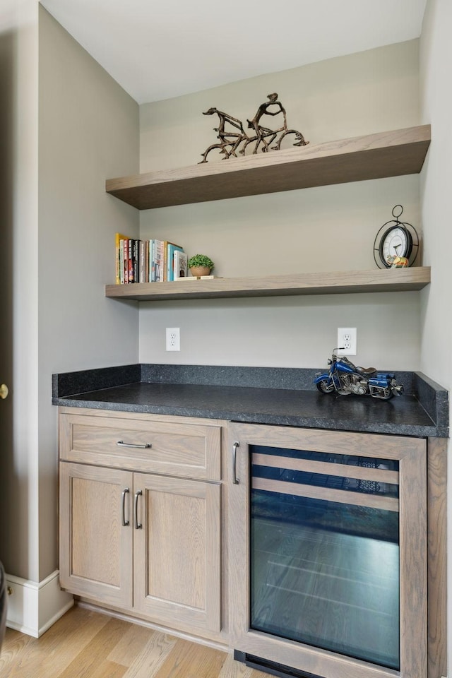 8118 Heirloom Blvd, College Grove, TN 37046 - indoor dry bar with wine cooler, light wood-type flooring, and baseboards
