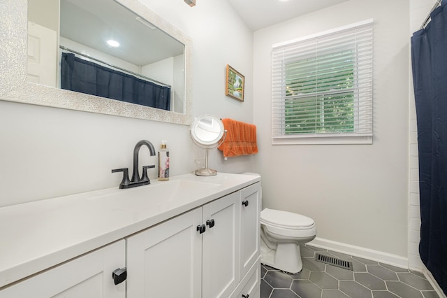 106 Aaron Dr, Burns, TN 37029 - full bath with vanity, toilet, tile patterned floors, baseboards, and recessed lighting