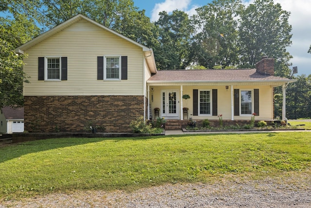 345 Big Spring Hollow Rd, Pulaski, TN 38478 - split level home with brick siding, a chimney, a front yard, and a porch